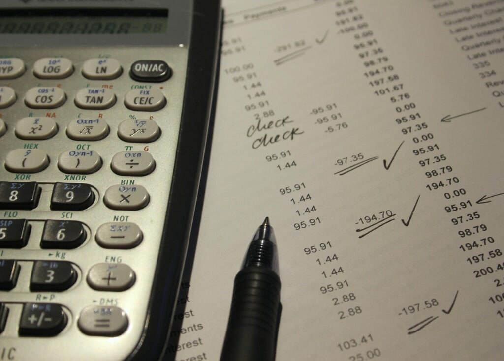 Calculator, pen and payment report